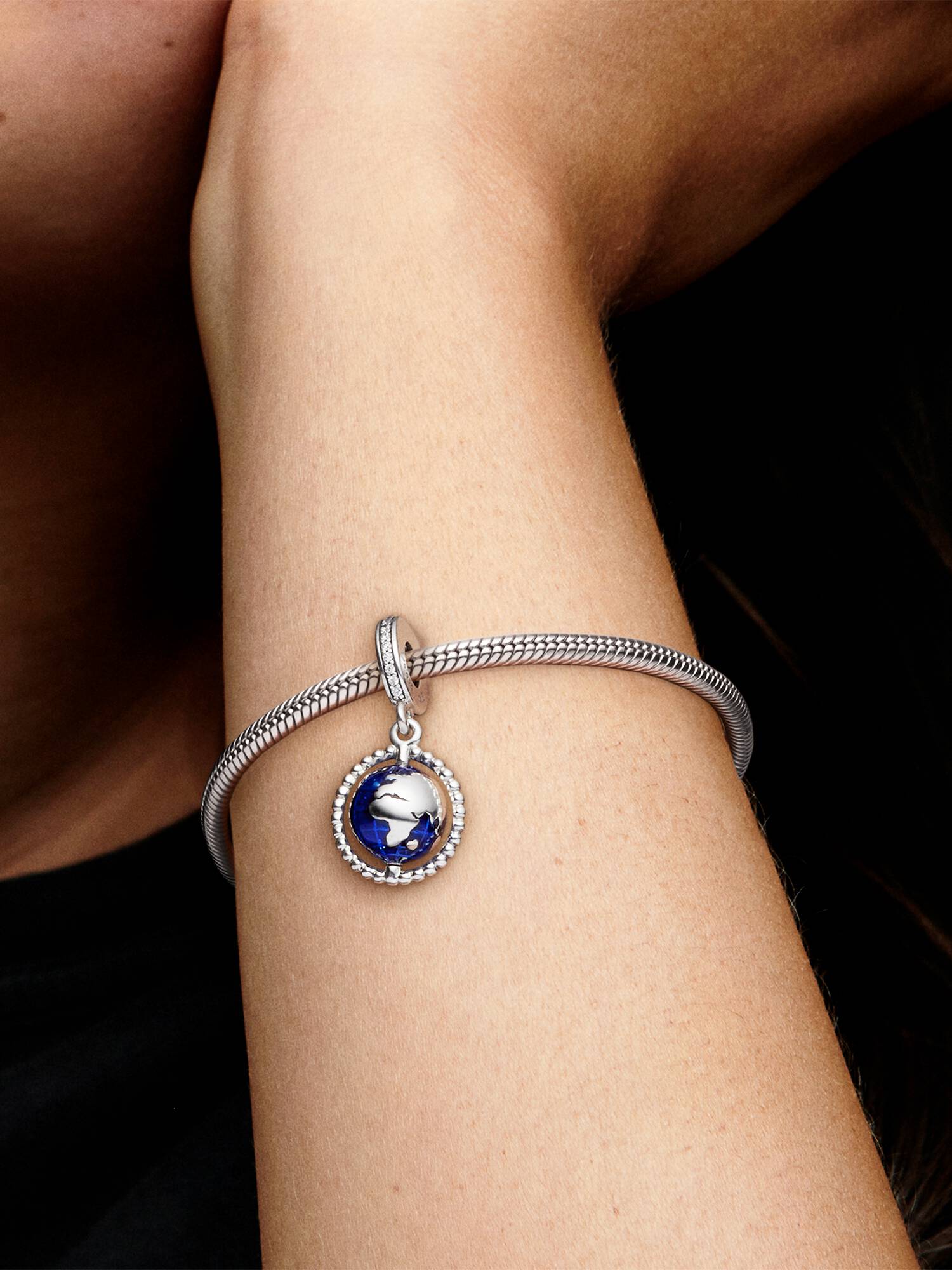 Globe silver dangle with clear cubic zirconia and blue enamel