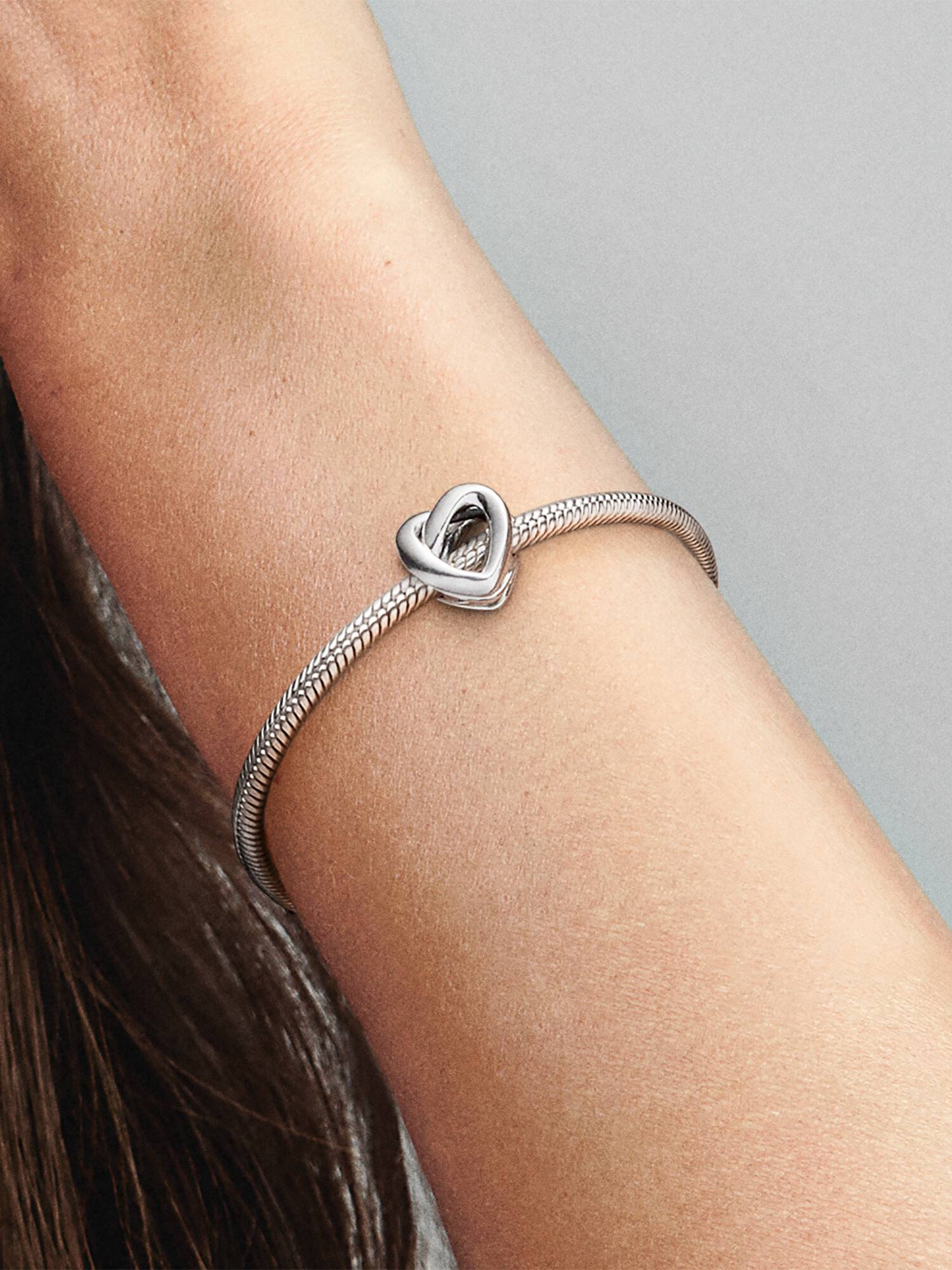 Knotted heart silver charm